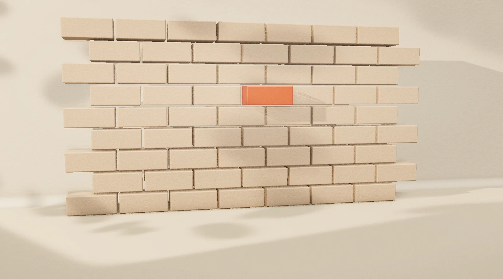 A wall of identical bricks, one of them orange