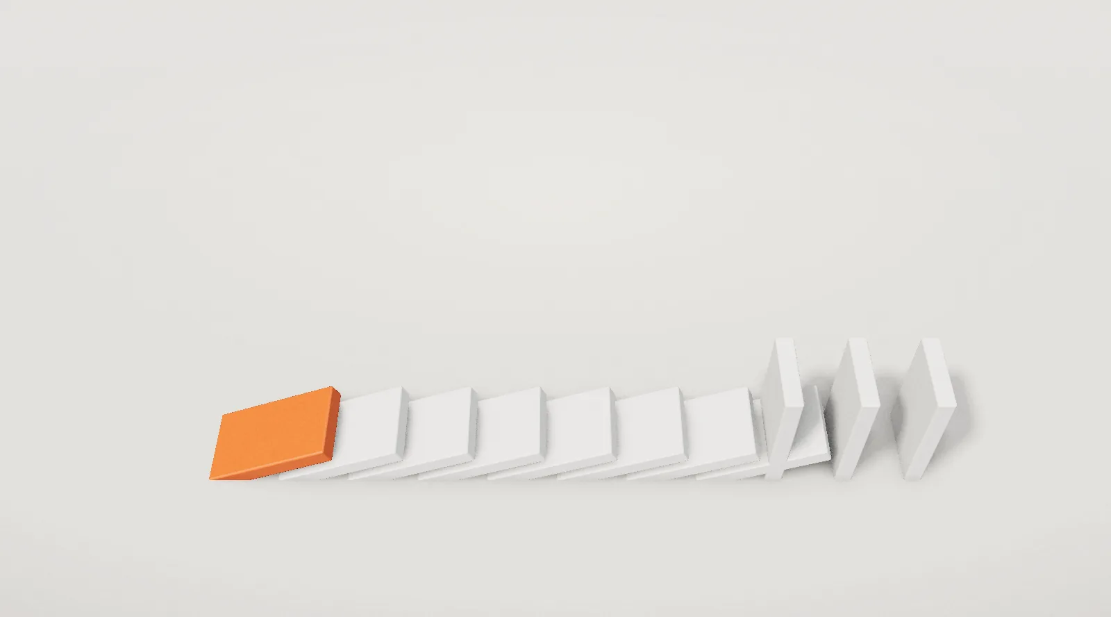 A row of dominoes, the first one orange, mid-fall