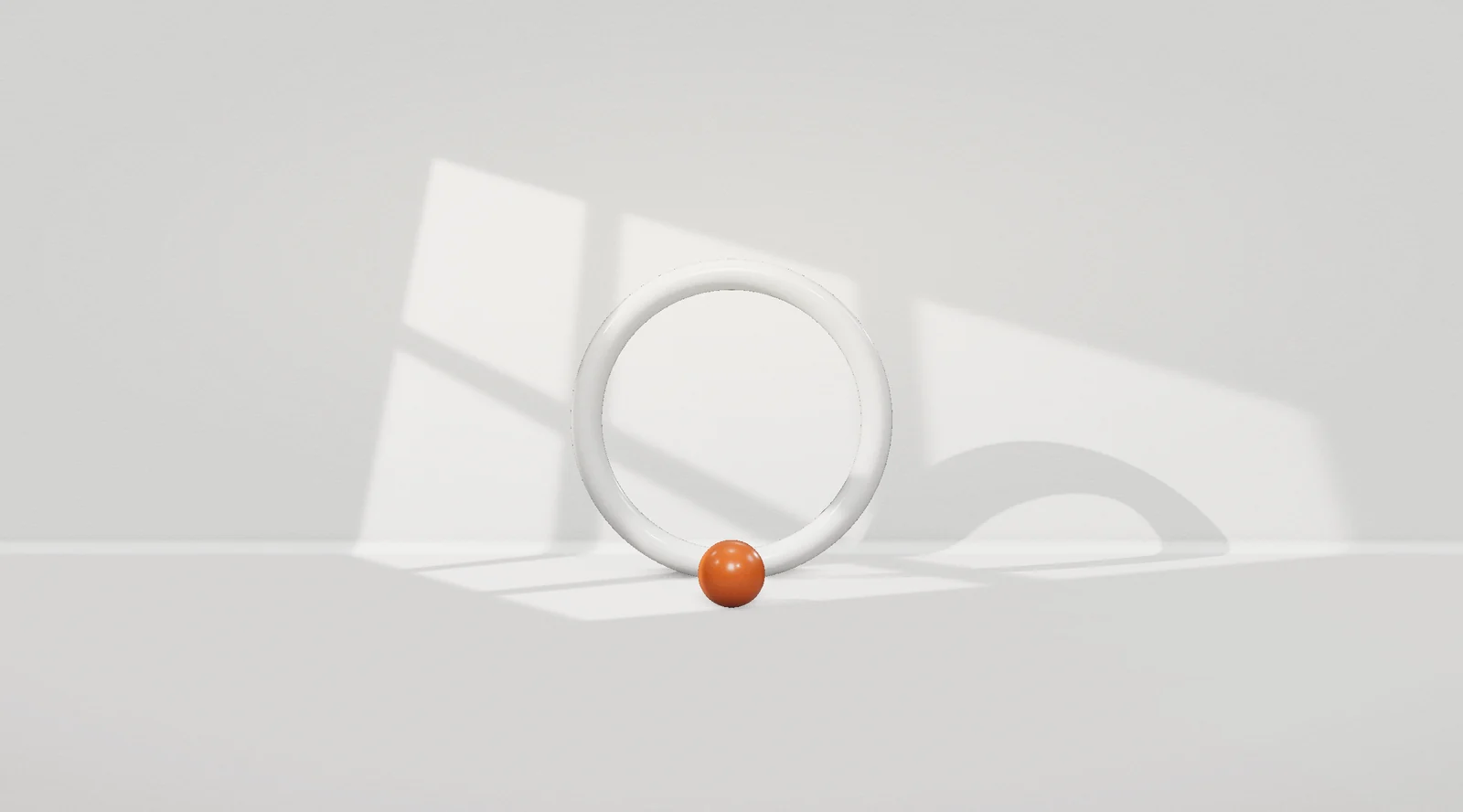 A white ring on paper, with one orange dot