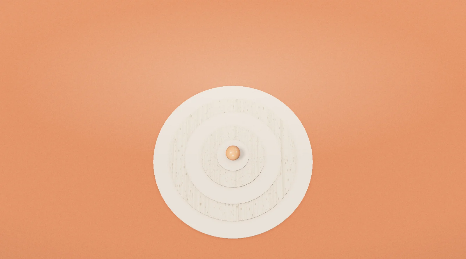 A target of pale rings on orange, one ball at the centre
