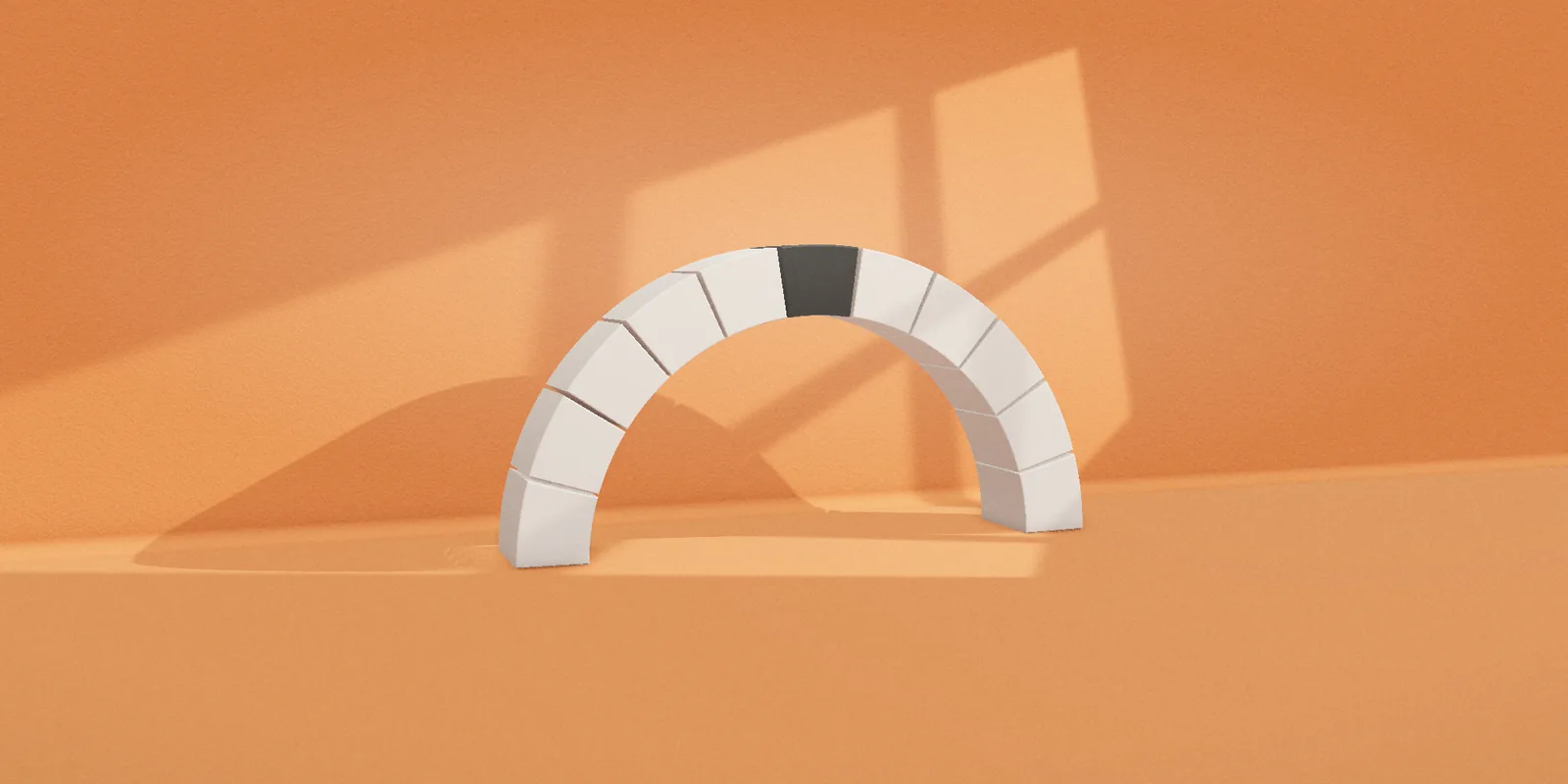 A white stone arch held by one dark keystone
