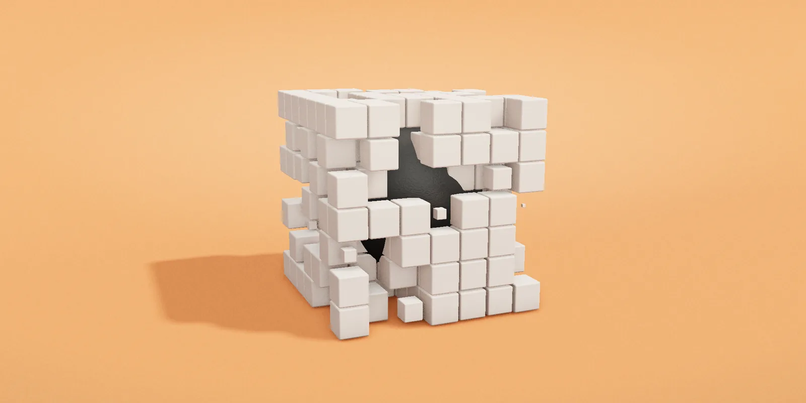 A block of white cubes being taken away to reveal a dark sphere
